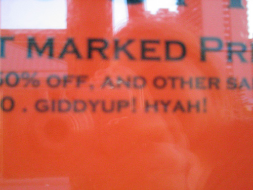 Closeup of a sign with the words "Giddyup! Hyah!"