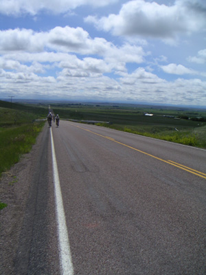 Bike riders going up a hill in Montana